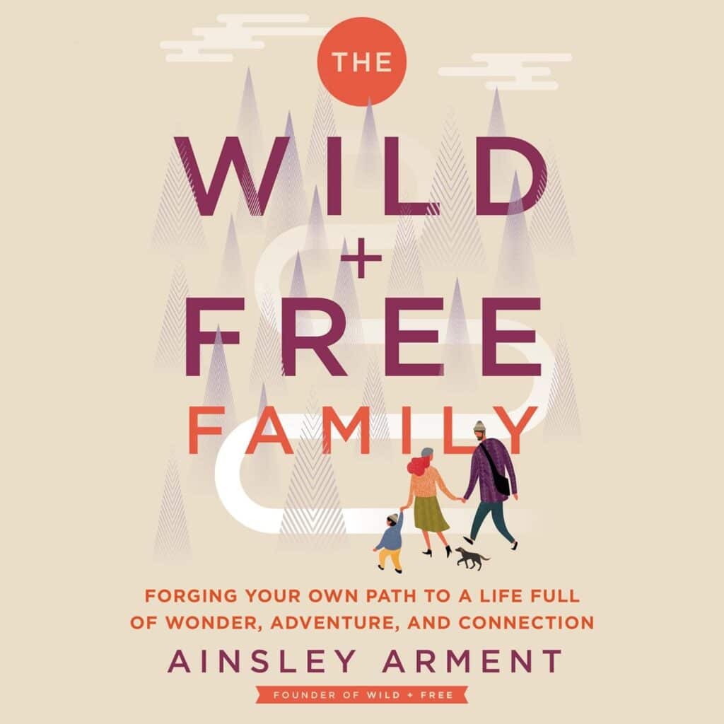 Book cover for "The Wild and Free Family" by Ainsley Arment. it shows a family in the foreground in animation style. There is a faded out forest in the background.