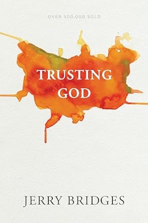 Book Cover for "Trusting God" by Jerry Bridges. It is a simple white cover with a splash of orange and green paint behind the title.