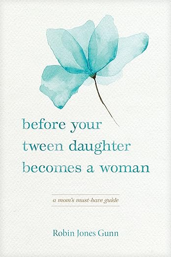 Book Cover for "Before Your Tween Daughter Becomes a Woman". It shows a watercolor style blue flower on a soft colored background.