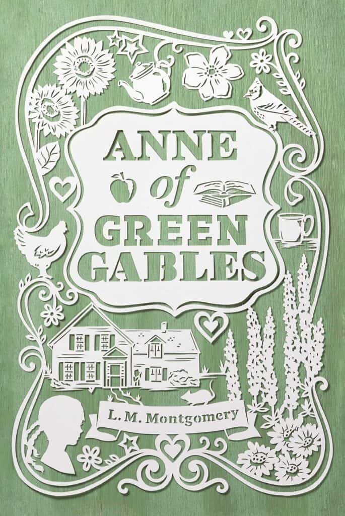 The Book Cover for "Anne of Green Gables" by L. M. Montgomery. It shows the silhouette of a young girl as well as a farmhouse and some flowers along side the title.
