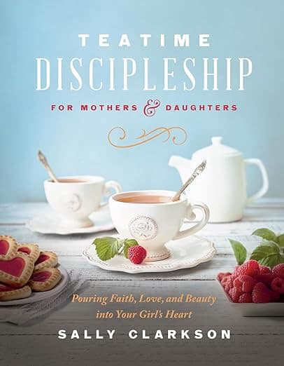 book cover for "Teatime Discipleship" by Sally Clarkson. It features a table with biscuits, strawberries, and a tea set with steaming tea.
