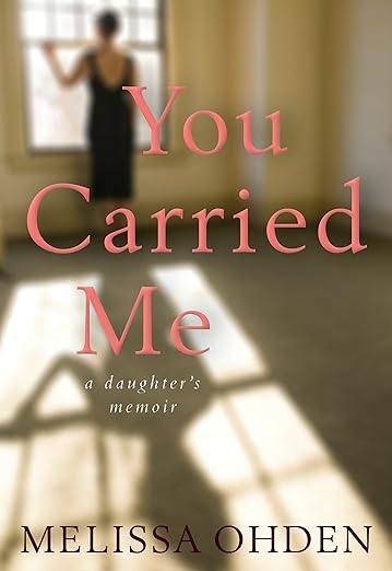 Book cover for "You Carried Me" by Melissa Ohden. It features a blurred image of a woman in a navy dress standing before an open window and looking out. Her shadow shows on the floor.