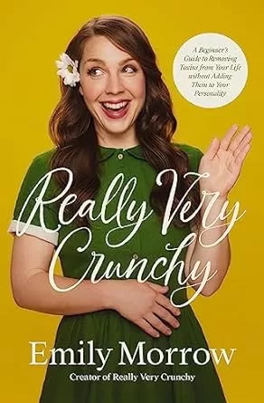 The Book Cover for "Really Very Crunchy" by Emily Morrow. It shows a woman in a short sleeve green dress and a flower in her hair with her hand up in a "hello" gesture.