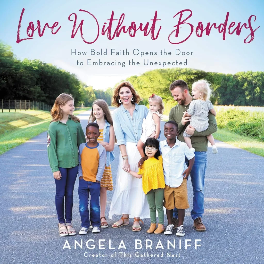 Book cover for "Love without borders" by Angela Braniff. If depicts the family of  multiple ethnicities standing on a road with trees in the background.