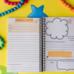 The Sermon Note Journal on yellow paper surrounded by colored beads. It is open to the sermon note page