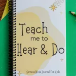 The Sermon Note Journal for Kids on green and yellow paper with colored pencils.